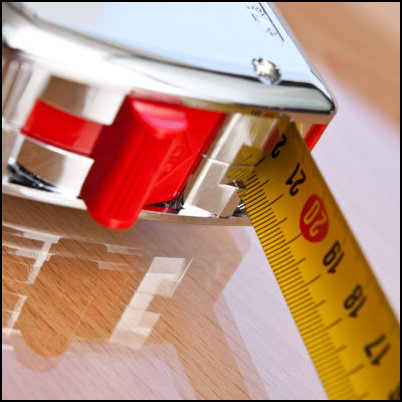 Close-up of a tape measure on a worktop during fitting