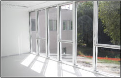 Reception room with full-height glazing and garden doors