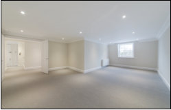 Large redecorated reception room with new carpet and downlights